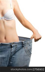 Women and jeans of the greater size. The concept of growing thin. It is isolated on a white background