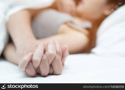 Women and men Having sex in the bedroom at the hotel