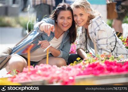 women are choosing the flowers for their wedding