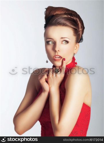 Women are emotional face on her grief in a red dress.