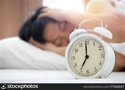 Women are frustrated when they hear the alarm clock.