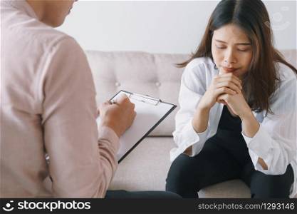 women Asian patients with man psychologist examination consulting and In psychotherapy by the physician in the clinic. psychiatrist concept