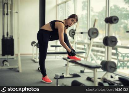 women asian tying shoe laces. fitness women getting ready for engage in the gym