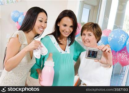 Women at a Baby Shower using Digital camera