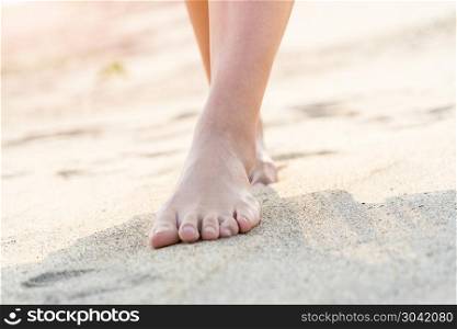 women barefoot walking on the white sand nature on the beach. su. women barefoot walking on the white sand nature on the beach. summer trip