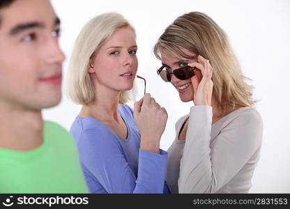 Women checking out a young man