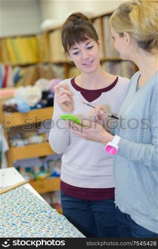 women choosing tissue at store