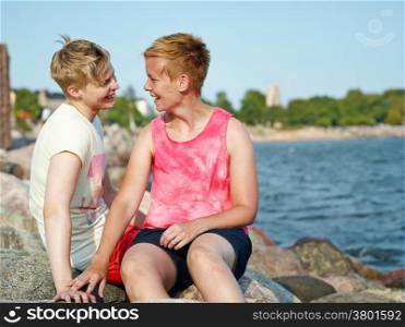 Women couple spend time together at the beach in the afternoon