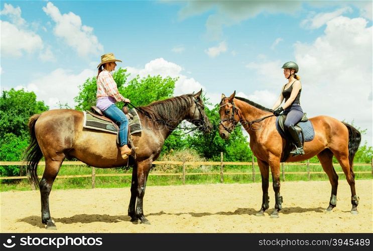 Women cowgirl and jocket riding horse. Activity.. Active women western cowgirl and jockey training riding horse. American girl in countryside ranch. Horseback sport activity.