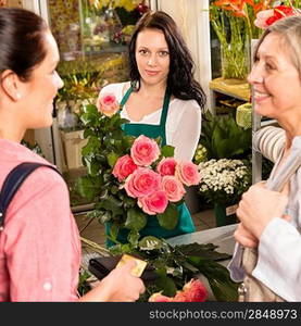 Women customers buying card flower shop pink roses florist