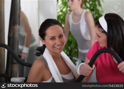 women discussing in gym club