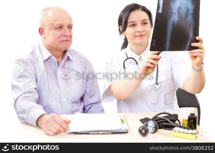 Women doctor showing a x-ray image to the patient.