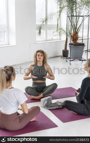 women doing yoga indoors