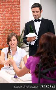Women drinking champagne in a restaurant