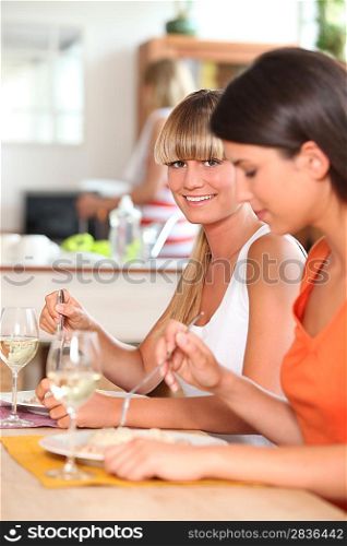 Women eating dinner together