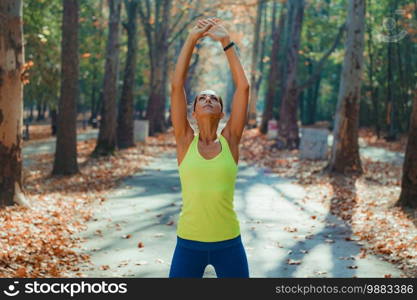 Women Exercising Outdoors, Park, Nature. Woman Stretching in the Park.