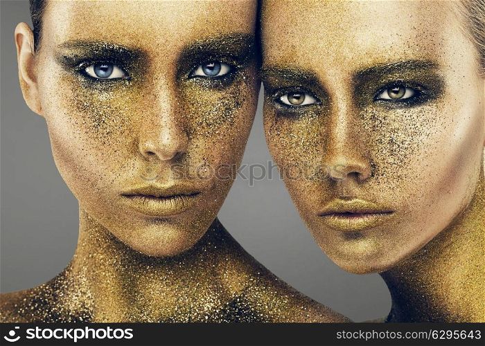 women faces in gold glitters
