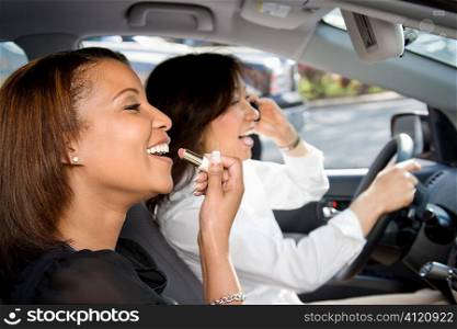 Women friends in car.