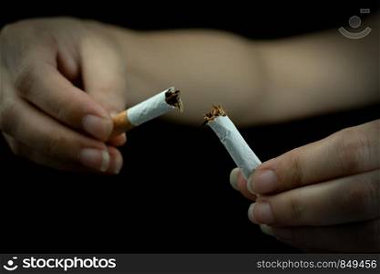 Women hand crushing cigarette, Concept Quitting smoking world no tobacco day