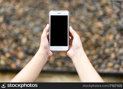 Women hand holding smart phone. business concept.