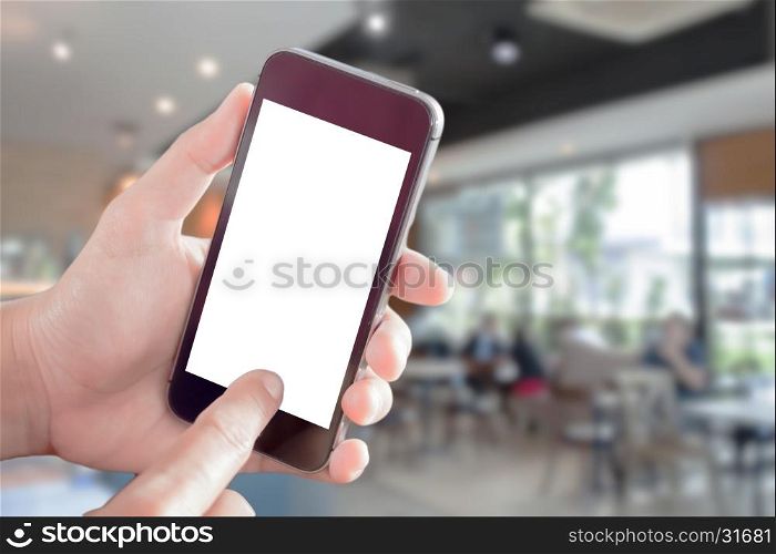 Women hand holding smartphone with blurred cafe interior for background