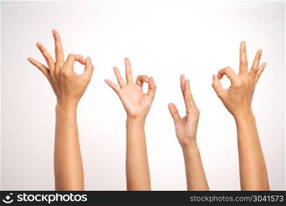 women hand OK sign and raise hand up gesturing on white backgrou. women hand OK sign and raise hand up gesturing on white background in four action