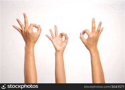 women hand OK sign gesturing on white background in three action