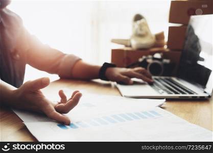 Women hand pointing at business document with using laptop computer, Online selling e-commerce shipping idea concept freelance start up small business owner