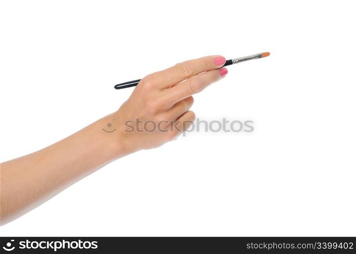 women hand with a black brush. Isolated on white background