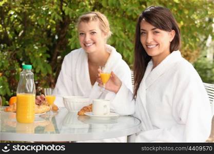 Women having breakfast outside