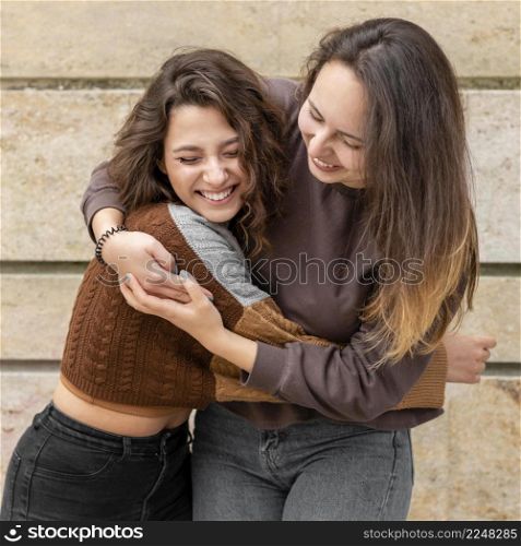 women having fun together outdoors