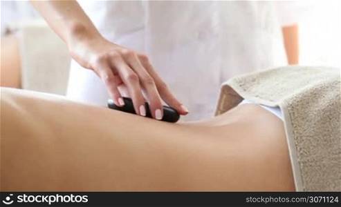 Women having stone therapy at spa session