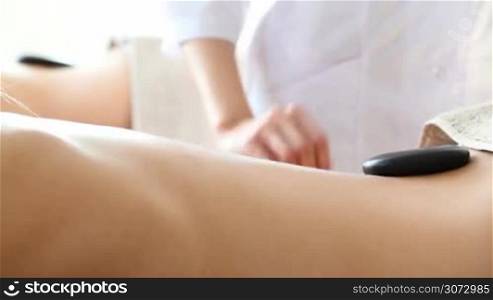 Women having stone therapy at spa session
