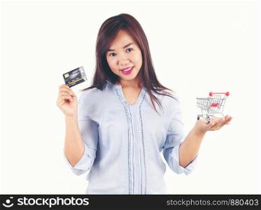 Women holding credit cards and shopping cart, shopping concept