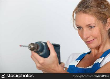 Women holding electric drill