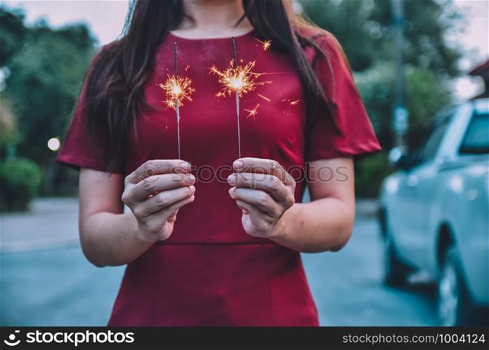 Women holding Fireworks Christmas and New Year Celebrations