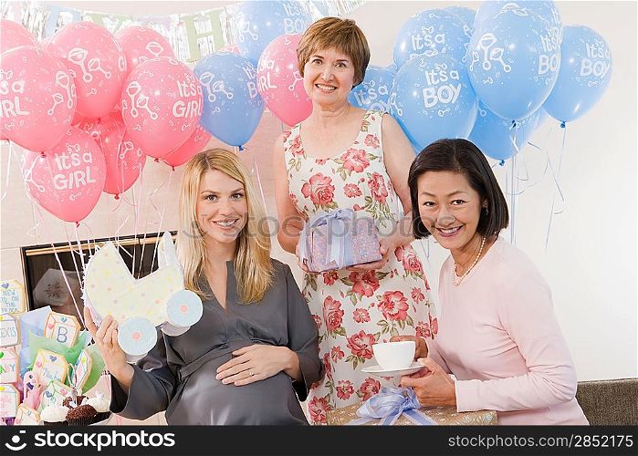 Women Holding Gifts at a Baby Shower