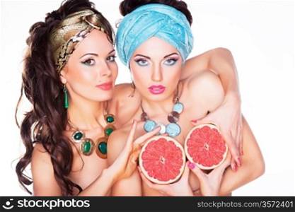 Women holding Grapefruits in hands - Diet and Nutrition concept