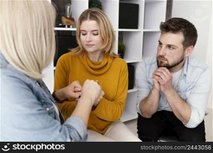women holding hands therapy session 2