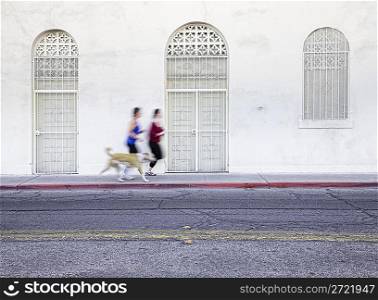 Women jogging with pet dog