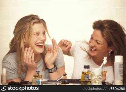 Women Laughing and Doing Their Makeup