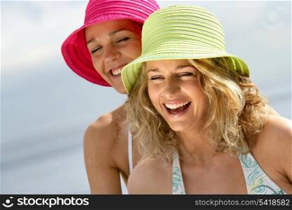 Women laughing at the beach