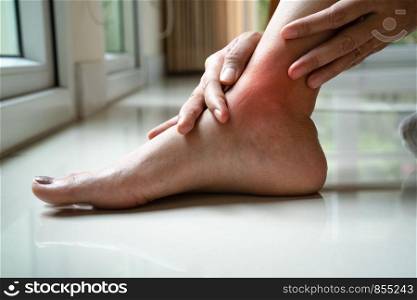 women leg ankle injury/painful, women touch the pain ankle leg