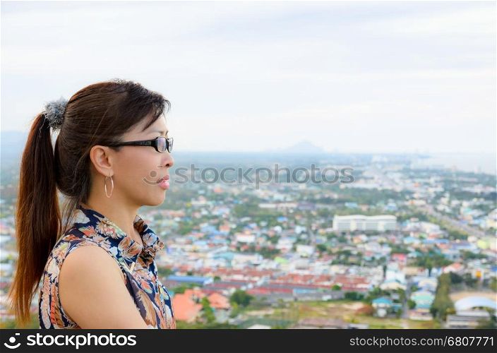 Women look at a view of the Hua Hin city from on high, Thailand