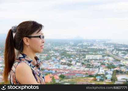 Women look at a view of the Hua Hin city from on high, Thailand