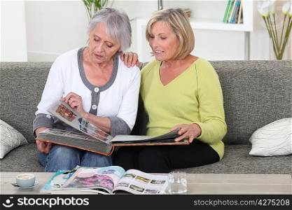 Women looking at photo album