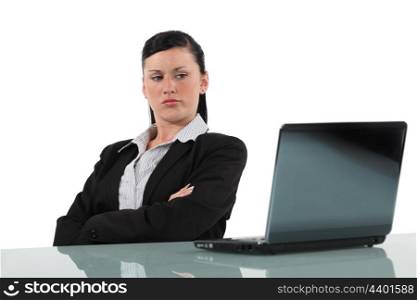Women looking disgruntled computer