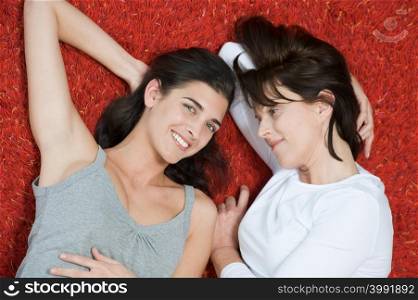Women lying on rug