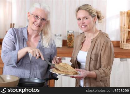 Women making crepes
