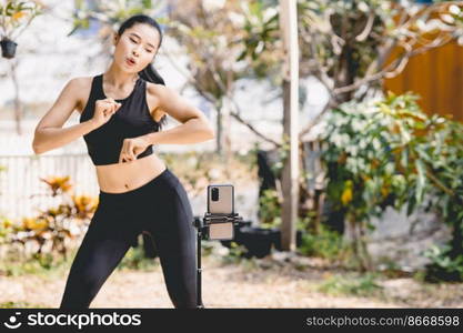 Women online influencer blogger content creator dancing show with smartphone video recording and live for social media.